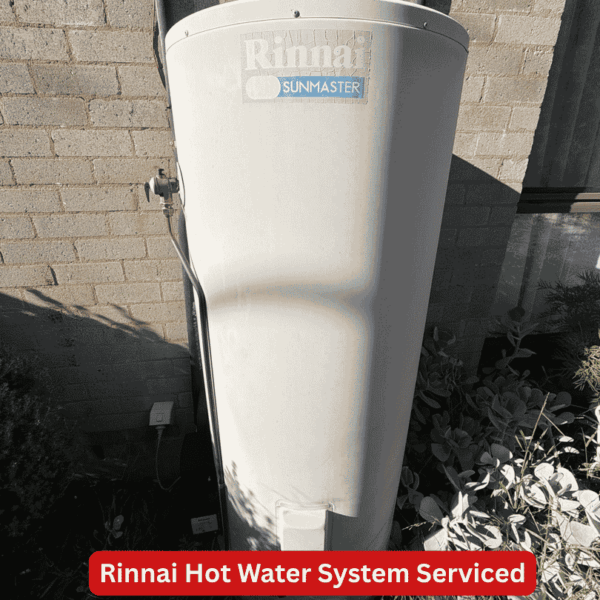 Image Annotated: Existing Rinnai Sunmaster solar hot water system serviced during the work at the Chapman home. Rinnai Sunmaster solar hot water storage tank beside a single-storey home in Chapman.